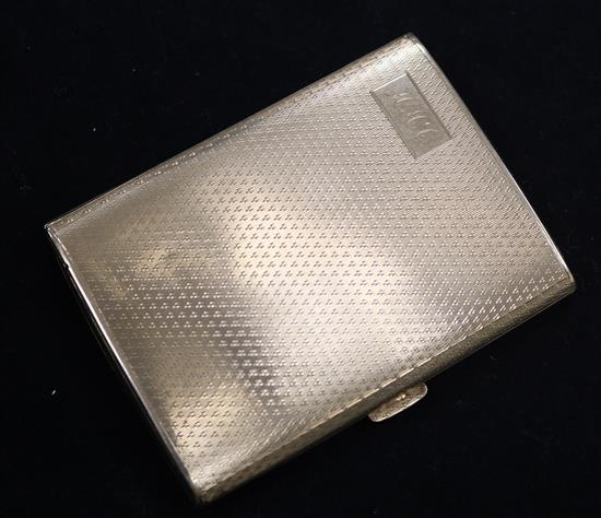 A late 1920s engine turned 9ct gold cigarette case, 3.25in.